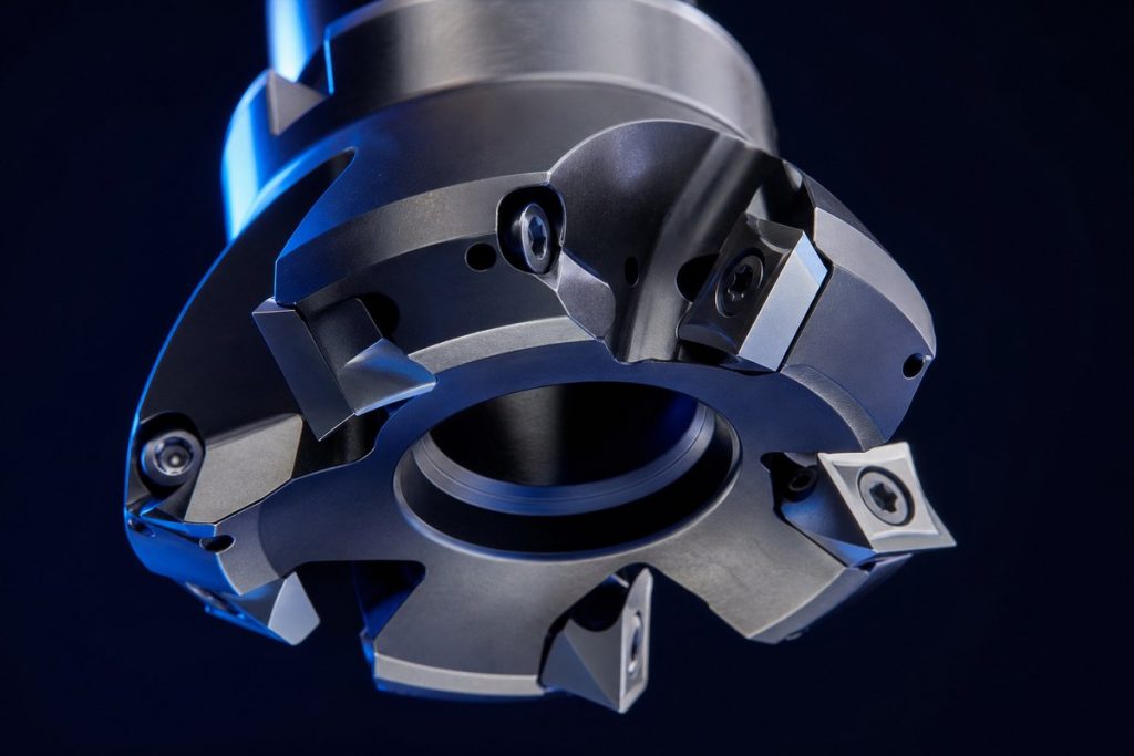 Underside of an indexable face mill showing seated inserts